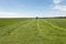 Pasture mowing with blue tractor