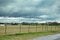 Pasture under Stormy Skies