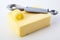 Pat of farm fresh butter with curl and curler