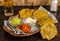 Patacones or tostones are fried green plantain slices