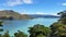 Patagonia Peaks and green hills with glacier lake