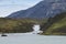 Patagonian landscape with lake and waterfall. Chile