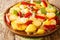 Patatas a lo pobre is a simple potato dish from Andalusian cuisine made of sliced potatoes are fried in olive oil with onion and