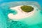 Patawan island. Small tropical island with white sandy beach. Beautiful island on the atoll, view from above