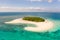 Patawan island. Small tropical island with white sandy beach. Beautiful island on the atoll, view from above