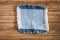 patch jeans on a wooden background