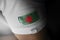 Patch of the national flag of the Bangladesh on a white t-shirt