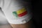 Patch of the national flag of the Benin on a white t-shirt