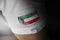 Patch of the national flag of the Kuwait on a white t-shirt