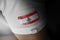 Patch of the national flag of the Lebanon on a white t-shirt