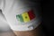 Patch of the national flag of the Senegal on a white t-shirt