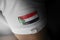 Patch of the national flag of the Sudan on a white t-shirt