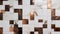 Patchwork arrangement of white marble and bronze tiles