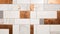 Patchwork arrangement of white marble and bronze tiles