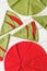 Patchwork and quilting concept - close-up on decorative red-and-green napkins on a whitewashed wooden floor, festive