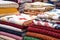 patchwork quilts draped over a stand