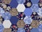 Patchwork seamless pattern from hexagonal patches with flowers, polka dot and denim print. Quilt design in blue and brown colors