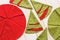 Patchwork and sewing concept - macro of decorative red-and-green napkins on whitewashed wooden floor, festive