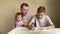 Paternity leave - father and two children at home, homework