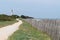 Path alley view of Lighthouse of Whales in Re Island France