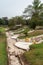 Path along graves at Chao Pho Khao Chalak Cemetery, Bang Phra, Thailand