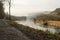 Path Along River on Foggy Day