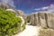 Path between boulders rocks La Digue island Seychelles, vacation background