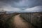 Path on the coast in bad and dark weather