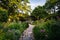 Path and flowers at the Shakespeare Garden, in Central Park, Man