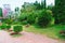 The path in the garden. pathway in the park, curve walkway on green grass field. courtyard and walkway in the park.