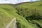 Path by hill leading down to Small beck