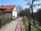 Path, home and trees in spring, Lithuania