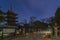 Path illuminated by lanterns along the Five storied pagoda of Kaneiji temple at night.