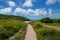 Path leading through the countryside towards the beach