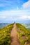 A path leading to viewpoint Miradouro da Boca do Inferno in Sao Miguel Island, Azores, Portugal. Amazing crater lakes surrounded