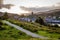 A path leads from right to left diagonally with the town of Tarbert leading to the horizon in Argyll and Bute Scotland UK
