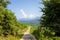 A path in the middle of the green mountains, in Asia, in Vietnam, in Tonkin, in Dien Bien Phu, in summer, on a sunny day