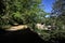 Path partially in the shade in a park on a sunny day