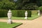 Path or pathway with ornamental urns and hedge