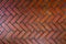 The path paved with red brick in herringbone pattern, Red stone walkway herringbone style pattern