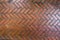 The path paved with red brick in herringbone pattern, Red stone walkway herringbone style pattern close-up