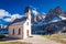 Path to church at Passo Gardena in spring, Dolomites, Italy