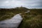 Path to lighthouse on Amrum island Germany after the rain on cloudy day