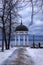 Path to rotunda on lake in winter