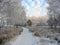 Path to the snow-covered winter park. Frosty trees