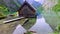 Path to a wooden cabin on a mountain lake Obersee, German Alps