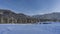 The path is trodden in a snow-covered valley between snowdrifts.