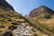 Path up Glencoe mountains Scotland UK in sunshine