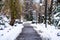 Path way made by people walking thru the snow in the park. Path in heavy snow. Winter concept snow-path in the evening light