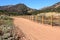 Pathway across the hills, dry grass fields